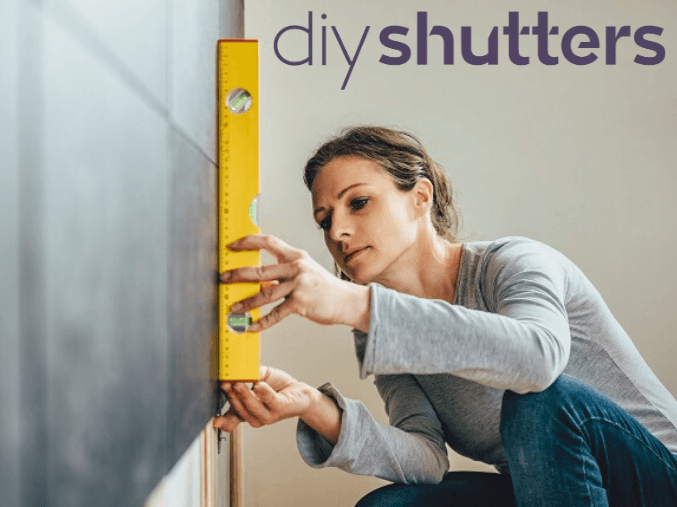 Untitled-design-(11)-(1)k.png Woman measuring for DIY shutters