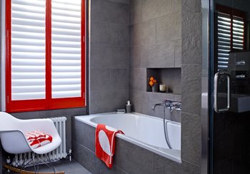 red shutters in grey bathroom