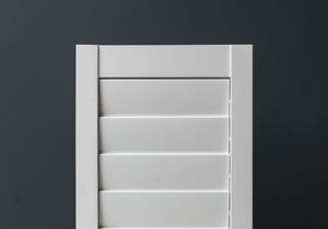 White painted window shutter slats
